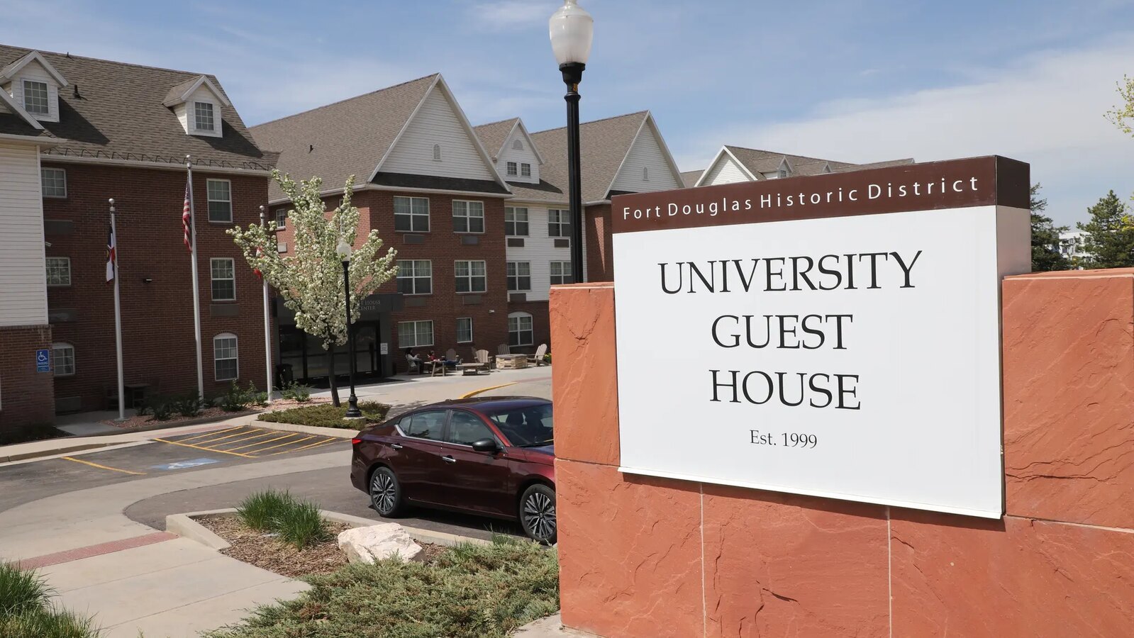 University Guest House exterior and entrance sign